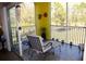 Relaxing screened-in balcony furnished with comfortable seating and serene nature views at 2060 Willow Hammock Cir # 201, Punta Gorda, FL 33983