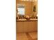 Well-lit bathroom with double sinks, mirrors, and comfortable floor mat at 2060 Willow Hammock Cir # 201, Punta Gorda, FL 33983