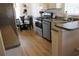 Modern kitchen with stainless steel appliances, sleek countertops, and breakfast nook dining area at 2060 Willow Hammock Cir # 201, Punta Gorda, FL 33983
