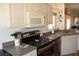 Well-equipped kitchen with modern stainless steel appliances and ample counter space at 2060 Willow Hammock Cir # 201, Punta Gorda, FL 33983