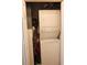 Efficiently designed laundry closet with stacked washer and dryer for convenience at 2060 Willow Hammock Cir # 201, Punta Gorda, FL 33983