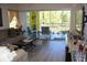 Comfortable living room with access to a screened-in balcony showcasing outdoor views at 2060 Willow Hammock Cir # 201, Punta Gorda, FL 33983