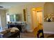 Inviting living room with a TV, console table and open view into an adjacent bathroom at 2060 Willow Hammock Cir # 201, Punta Gorda, FL 33983