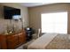 Comfortable main bedroom with desk and large window overlooking the community at 2060 Willow Hammock Cir # 201, Punta Gorda, FL 33983