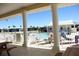 Inviting pool area surrounded by palm trees, lounge chairs and pristine white structures at 2060 Willow Hammock Cir # 201, Punta Gorda, FL 33983