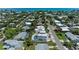 Breathtaking aerial view highlighting the property's pool, deck, and proximity to the beach and surrounding neighborhood at 215 83Rd St, Holmes Beach, FL 34217