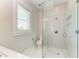 Modern bathroom with a glass-enclosed shower, sleek fixtures, and a bright, airy feel at 215 83Rd St, Holmes Beach, FL 34217
