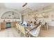 Open dining room features a stylish chandelier, seamlessly blends with the kitchen, and perfect for gatherings at 215 83Rd St, Holmes Beach, FL 34217