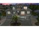 Beautiful home featuring classic architectural design with a well-manicured lawn and a charming driveway at 215 83Rd St, Holmes Beach, FL 34217