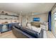 Inviting living room with a bar area, comfortable seating, and a flat screen TV for entertainment at 215 83Rd St, Holmes Beach, FL 34217