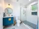 Modern bathroom with sleek vanity, glass shower, and gold fixtures at 2308 Tulip St, Sarasota, FL 34239