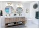 Modern bathroom with dual vanities, stylish fixtures, and decorative accents at 2308 Tulip St, Sarasota, FL 34239
