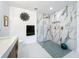 Elegant bathroom featuring white walls, artistic decor, and a luxurious walk-in shower with marble tile at 2308 Tulip St, Sarasota, FL 34239