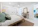 Sunlit bedroom with a comfortable bed, a vanity, and ensuite bathroom access at 2308 Tulip St, Sarasota, FL 34239