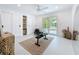 Bonus room with large sliding glass doors leading to an outdoor pool area, featuring recessed lighting and ceiling fan at 2308 Tulip St, Sarasota, FL 34239
