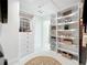 Spacious walk-in closet with built-in shelving, drawers, and ample storage space at 2308 Tulip St, Sarasota, FL 34239