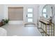 Bright entryway featuring a decorative mirror, console table, and modern decor at 2308 Tulip St, Sarasota, FL 34239
