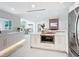 Bright, open kitchen with modern appliances, a spacious island, and views into the living area at 2308 Tulip St, Sarasota, FL 34239