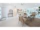 Open concept living space with neutral furniture and dining area at 2308 Tulip St, Sarasota, FL 34239