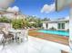 Inviting backyard pool area with lounge chairs and outdoor dining at 2308 Tulip St, Sarasota, FL 34239