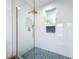 Contemporary walk-in shower with decorative tile and premium hardware at 2308 Tulip St, Sarasota, FL 34239