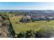 Drone shot of a home featuring manicured landscaping in a waterfront community at 2322 5Th E St, Palmetto, FL 34221