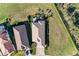 Aerial view of property showcasing the home, expansive backyard, patio, and surrounding greenery at 2322 5Th E St, Palmetto, FL 34221