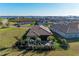 Aerial view of a home showcasing the backyard patio and landscaping with water view at 2322 5Th E St, Palmetto, FL 34221