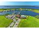 Aerial view showcasing community amenities including pool, clubhouse, and a marina at 2322 5Th E St, Palmetto, FL 34221