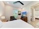Bedroom featuring neutral walls, a ceiling fan, and doorway to an adjoining bathroom at 2322 5Th E St, Palmetto, FL 34221