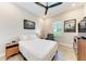 Bedroom with ceiling fan and hardwood style floors; artwork on the walls at 2322 5Th E St, Palmetto, FL 34221