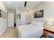 Bedroom features neutral walls, ceiling fan, and light colored wood-look floors at 2322 5Th E St, Palmetto, FL 34221
