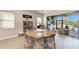 Dining area with wood table, chairs, and an outdoor kitchen space at 2322 5Th E St, Palmetto, FL 34221
