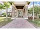Community clubhouse with a stone entrance, lush landscaping, and modern architectural details at 2322 5Th E St, Palmetto, FL 34221