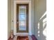 Inviting front door with a glass panel, decorative wreath, and a 'Happy' welcome mat at 2322 5Th E St, Palmetto, FL 34221