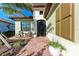 Charming front porch with chairs, planters, and a brick walkway leading to the entrance at 2322 5Th E St, Palmetto, FL 34221