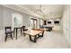 Well-lit game room featuring a ping pong table, pool table, and comfortable seating areas at 2322 5Th E St, Palmetto, FL 34221