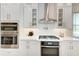 Modern kitchen features stainless steel appliances, white cabinets and subway tile at 2322 5Th E St, Palmetto, FL 34221
