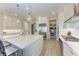 A bright, open kitchen features modern appliances, white cabinetry, and subway tile backsplash at 2322 5Th E St, Palmetto, FL 34221