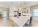 A kitchen features a large island with quartz countertops and pendant lighting at 2322 5Th E St, Palmetto, FL 34221