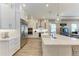 A bright, open kitchen featuring modern appliances, white cabinetry, and subway tile backsplash at 2322 5Th E St, Palmetto, FL 34221
