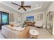 Bright living room featuring stylish furniture, a modern TV, and elegant decor at 2322 5Th E St, Palmetto, FL 34221