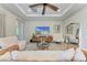 Spacious living room with a large ceiling fan, a TV, and modern furniture at 2322 5Th E St, Palmetto, FL 34221