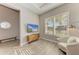 Comfortable living room showcasing a TV, accent chair, and a bench, perfect for relaxation at 2322 5Th E St, Palmetto, FL 34221