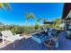 Outdoor patio featuring a modern fire pit, comfortable seating, and lush landscaping at 2322 5Th E St, Palmetto, FL 34221