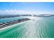 Gorgeous aerial view of a beach, hotels, waterfront, and Tampa Bay ocean on a beautiful, sunny day at 256 144Th Ave, Madeira Beach, FL 33708
