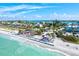 Picturesque aerial view of a beach, local shops, and dining on a beautiful, sunny day in Tampa Bay at 256 144Th Ave, Madeira Beach, FL 33708