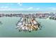 Breathtaking aerial view of waterfront homes with boat docks nestled in a tranquil harbor at 256 144Th Ave, Madeira Beach, FL 33708