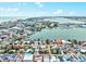 Panoramic aerial view of a coastal community with ocean and bay access, featuring diverse real estate at 256 144Th Ave, Madeira Beach, FL 33708
