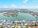 Gorgeous aerial view of waterfront homes, canals, and the Tampa Bay ocean on a beautiful, sunny day at 256 144Th Ave, Madeira Beach, FL 33708